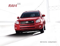 a red toyota rav4 is driving on a bridge
