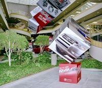 a tree in the middle of a parking lot