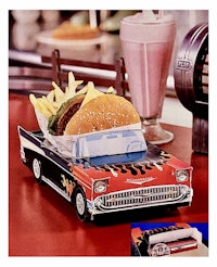 a car with a hamburger on top of it