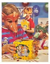 a child is holding a box with a mask on it