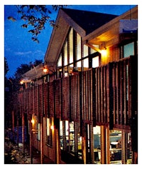 a building with a balcony at night